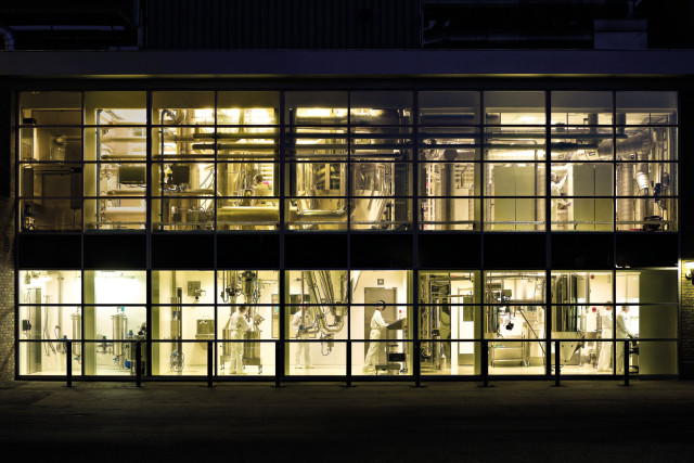 Process Industry - looking in the Windows of a factory by night | CBC | Cross-Border Communications | Leading international B2B branding and marketing agency