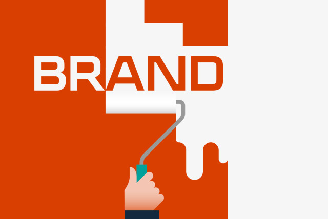 Illustration of a hand using a paint roller to reveal the word 'BRAND' on a red and white background. The image represents the concept of brand activation and strategic marketing during economic downturns.