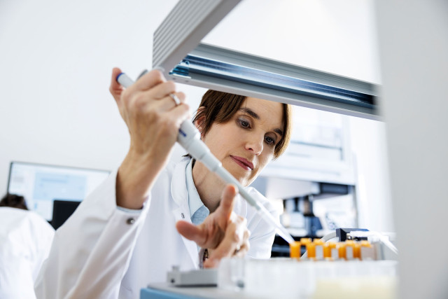 Nanion Technologies, Accelerating brand effectiveness, brand photo of Scientist working in a lab | CBC | Cross-Border Communications | Leading international B2B branding and marketing agency