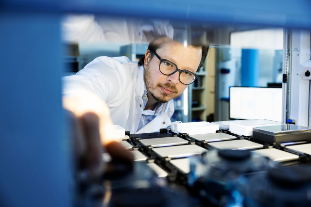 Nanion Technologies, Accelerating brand effectiveness, brand photo of scientist working in a lab | CBC | Cross-Border Communications | Leading international B2B branding and marketing agency
